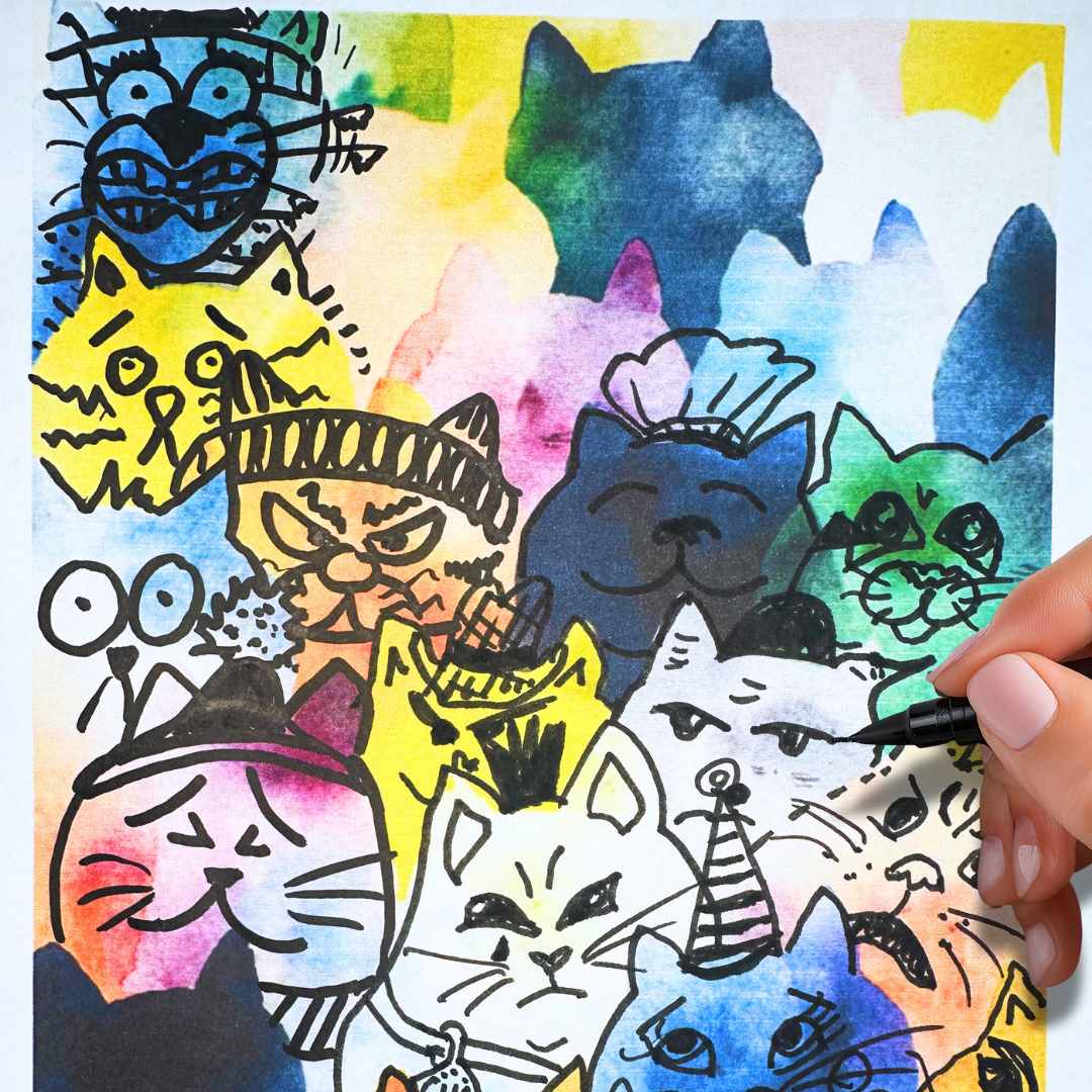 Colorful drawing worksheet of funny grumpy cats and funny kittens with a hand holding a marker.