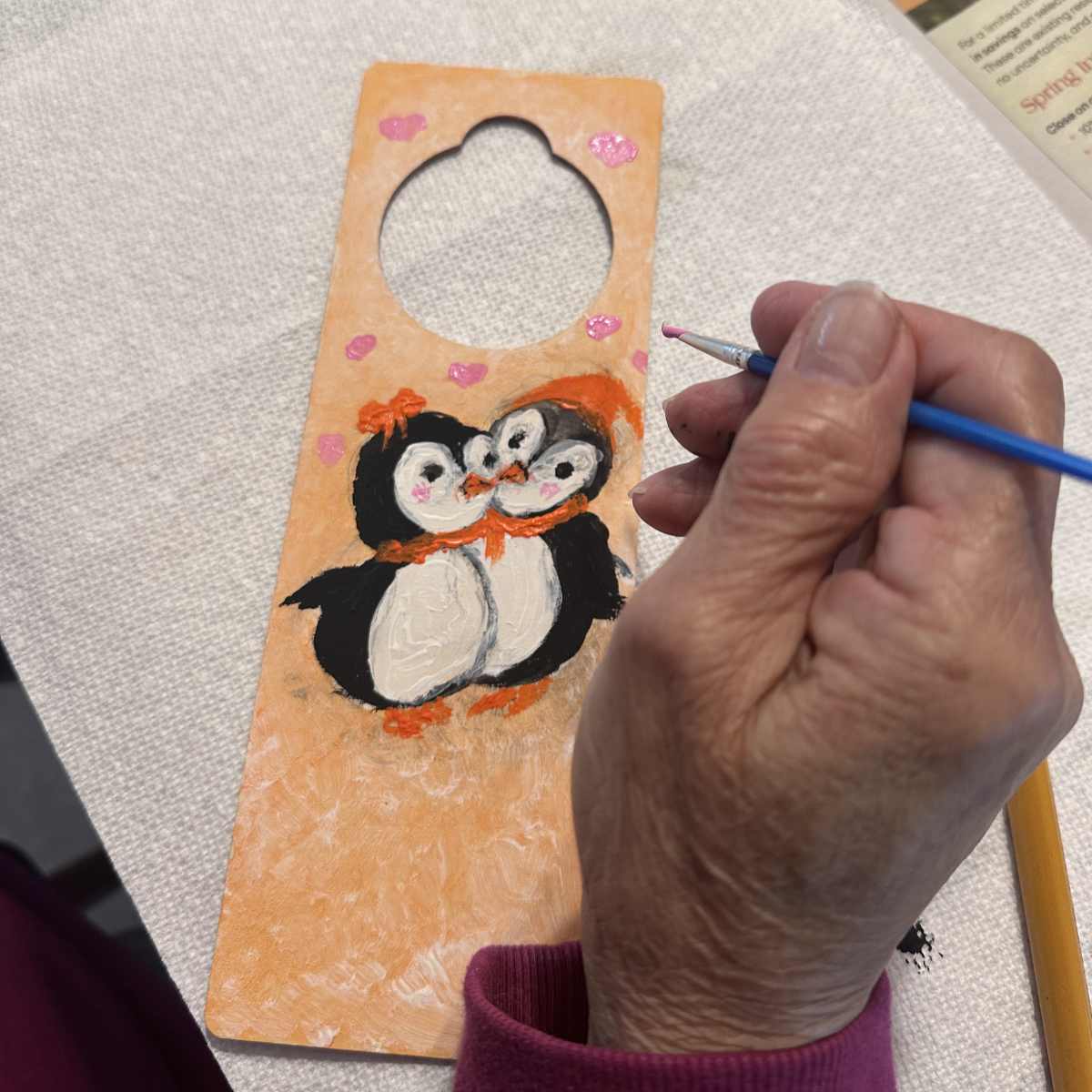 Small wooden craft kit being painted in progress, easy activity to do with grandparents