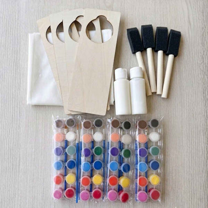 DIY wooden door hanger paint kit with brushes and paint pods for screen-free family craft night