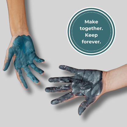 Two hands with blue and gray paint, one above the other, on a light gray background with a circular text overlay.